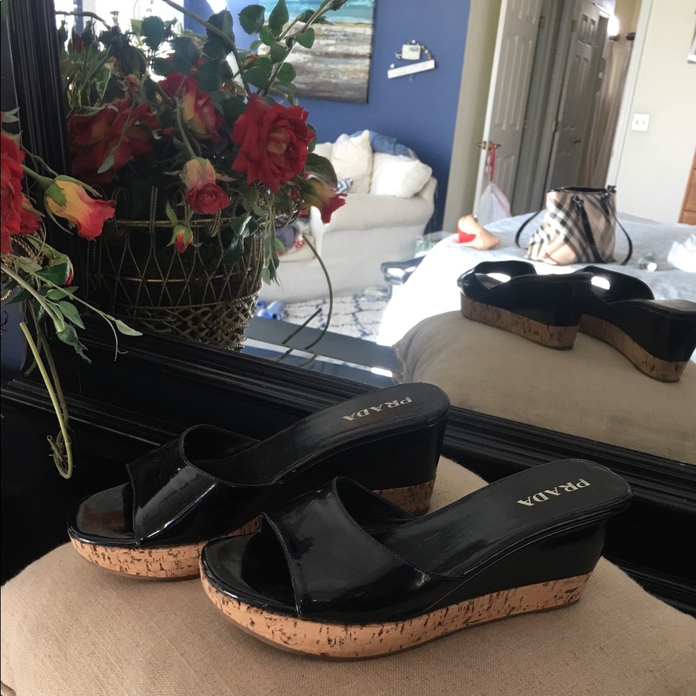 Prada black pattens leather wedge sandals with 3 inch heel.